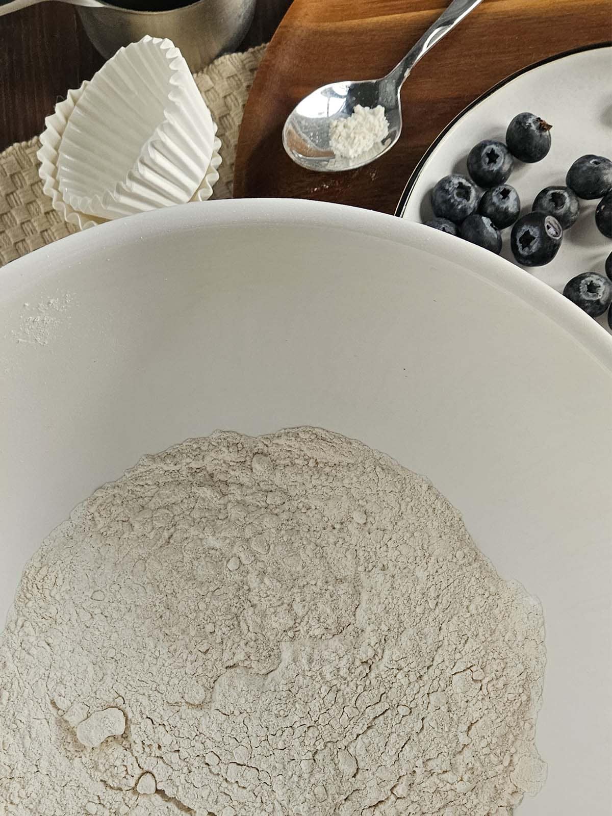 Sourdough blueberry dry ingredients in a white bowl.